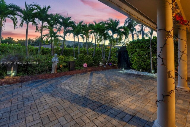 view of patio terrace at dusk