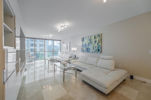 living room featuring track lighting and expansive windows