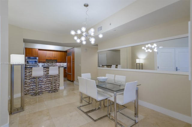 dining area featuring a notable chandelier