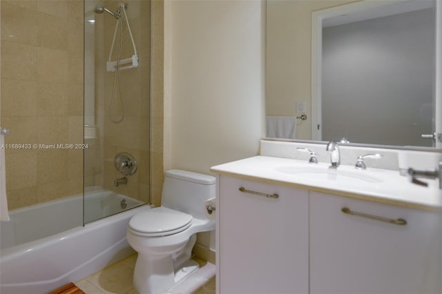 full bathroom featuring tile patterned floors, toilet, vanity, and tiled shower / bath