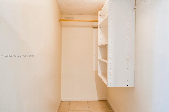 spacious closet featuring tile patterned floors