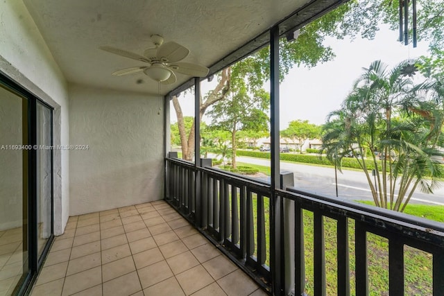 unfurnished sunroom featuring a wealth of natural light and ceiling fan