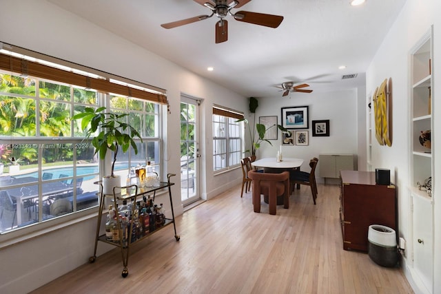 dining room featuring ceiling fan and light hardwood / wood-style flooring