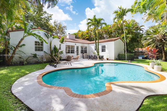 view of pool featuring a patio area