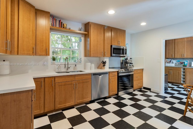 kitchen featuring decorative backsplash, sink, and stainless steel appliances