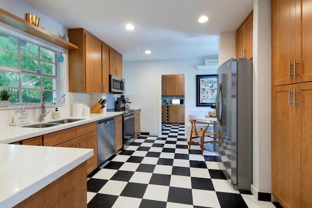 kitchen with sink and appliances with stainless steel finishes