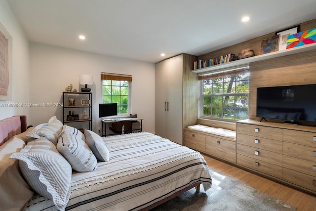 bedroom with light wood-type flooring