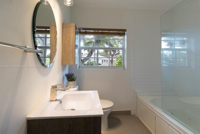 full bathroom with tile patterned flooring, tiled shower / bath combo, toilet, and a wealth of natural light