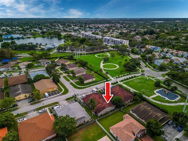 birds eye view of property featuring a water view