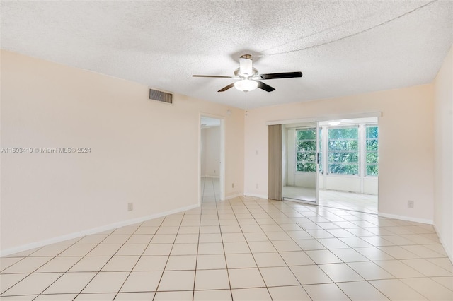 608 SW Natura Blvd Unit 311, Deerfield Beach, FL 33441 - unfurnished room featuring a ceiling fan and a textured ceiling