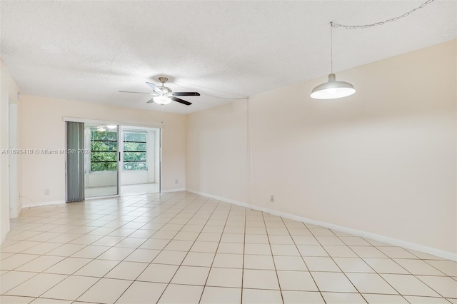 608 SW Natura Blvd Unit 311, Deerfield Beach, FL 33441 - spare room featuring ceiling fan and a textured ceiling