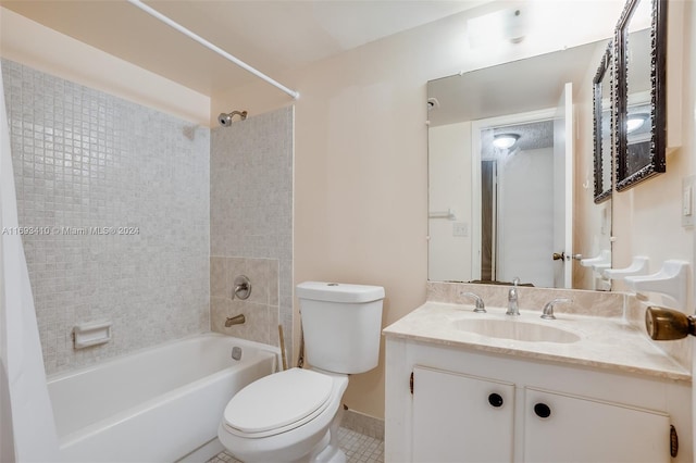 full bathroom with toilet, vanity, tile patterned floors, and tiled shower / bath