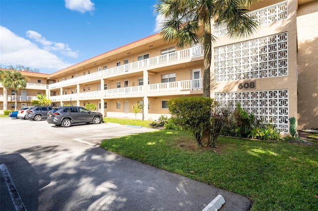 608 SW Natura Blvd Unit 311, Deerfield Beach, FL 33441 - view of apartment building / complex with uncovered parking