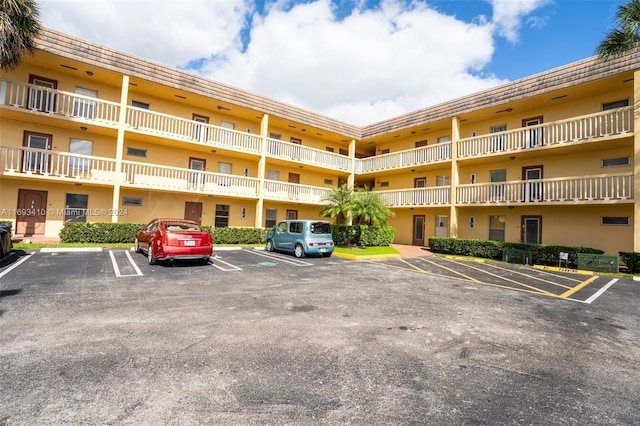 608 SW Natura Blvd Unit 311, Deerfield Beach, FL 33441 - view of apartment building / complex featuring uncovered parking