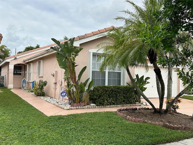 view of side of property with a yard