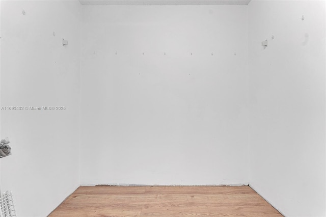 unfurnished room featuring light wood-type flooring