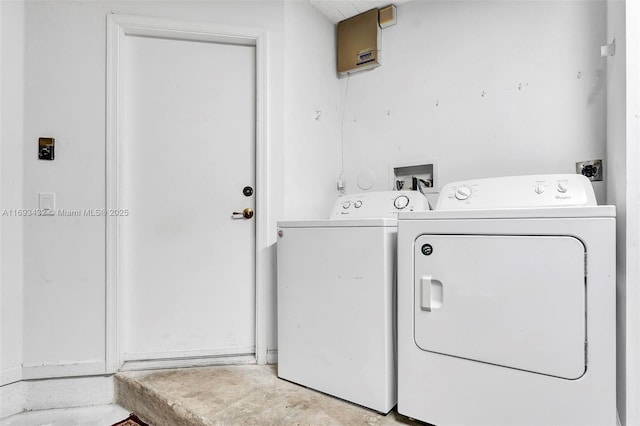 clothes washing area featuring laundry area and washing machine and clothes dryer