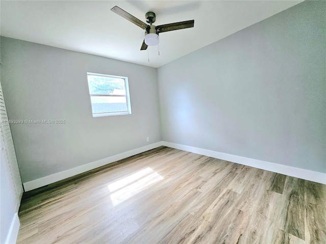 empty room with light hardwood / wood-style floors and ceiling fan