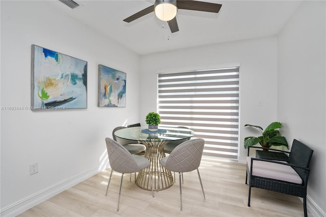 dining area featuring ceiling fan and light hardwood / wood-style flooring