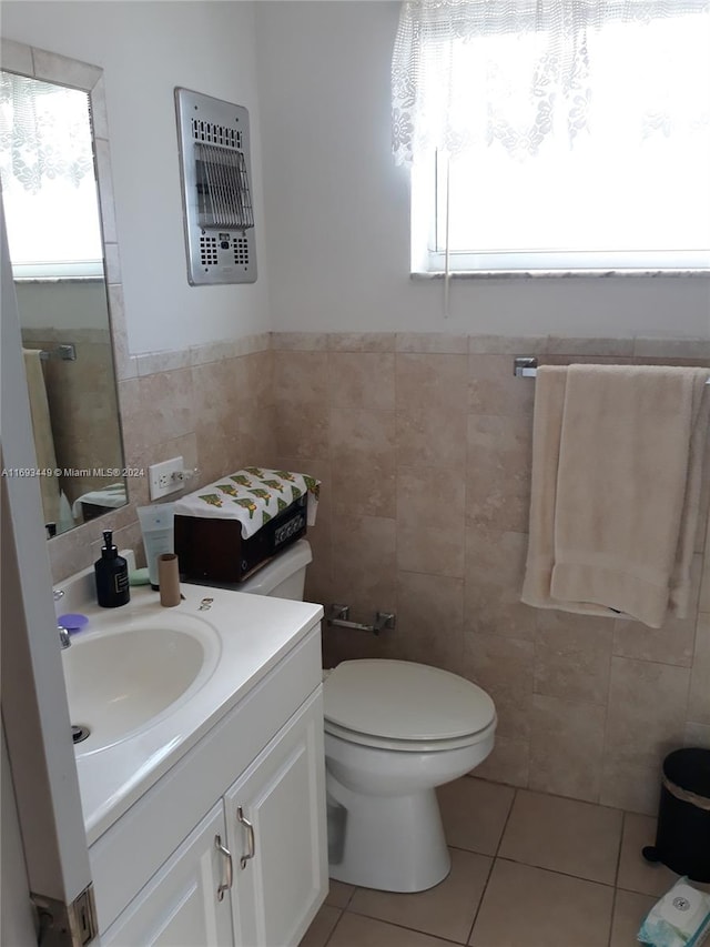 bathroom featuring tile walls, vanity, and tile patterned floors