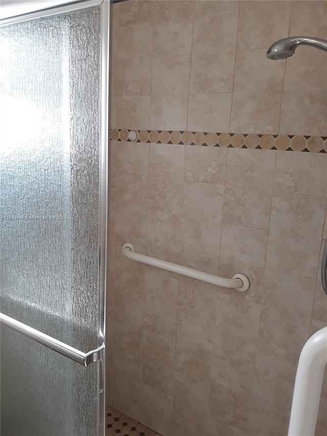 bathroom featuring an enclosed shower