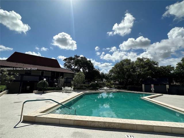 view of swimming pool with a patio