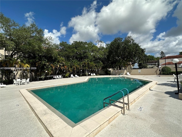 view of swimming pool featuring a patio