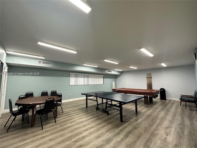 playroom with wood-type flooring