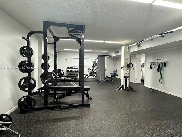 workout area with a textured ceiling