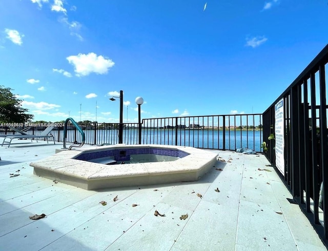 view of pool with a water view