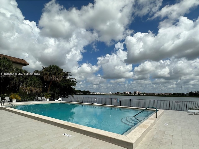 view of swimming pool with a patio