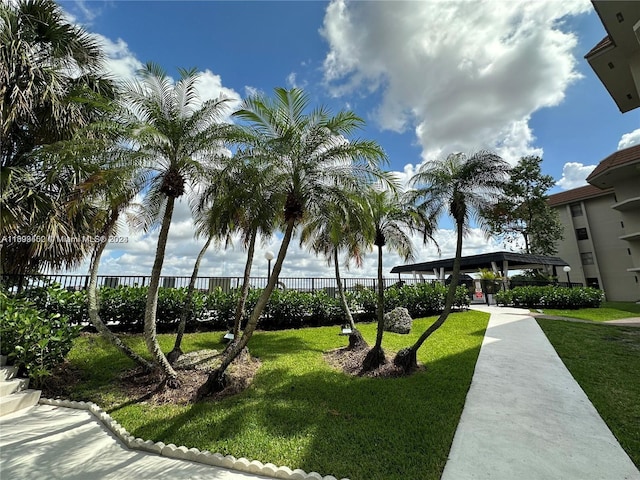 view of property's community featuring a yard