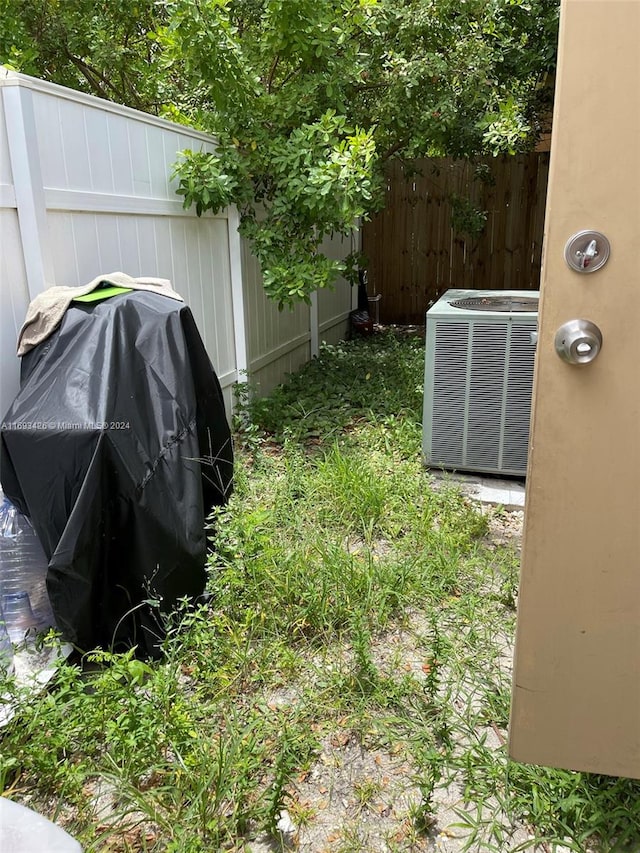 view of yard featuring central air condition unit