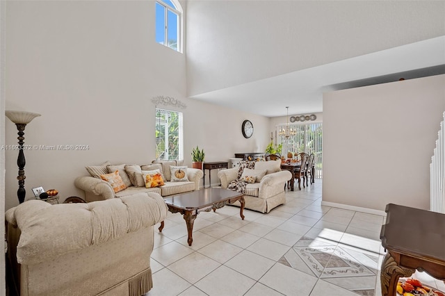 living room with an inviting chandelier, light tile patterned floors, and plenty of natural light