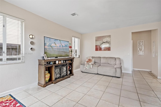 living room featuring light tile patterned flooring