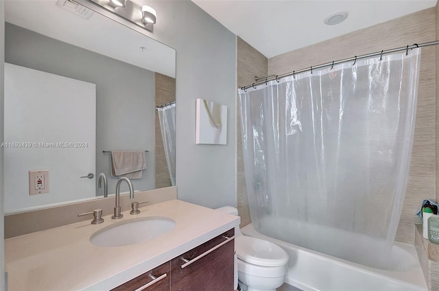 full bathroom featuring vanity, toilet, and shower / bathtub combination with curtain