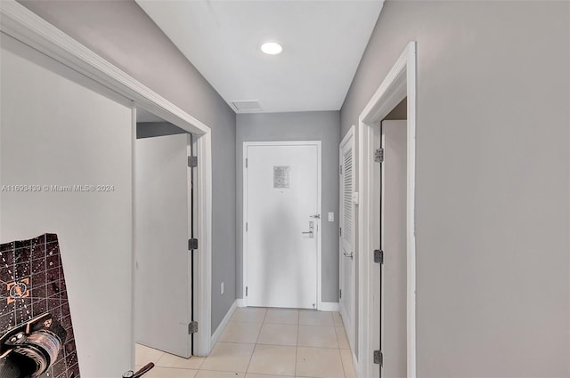 hallway with light tile patterned flooring