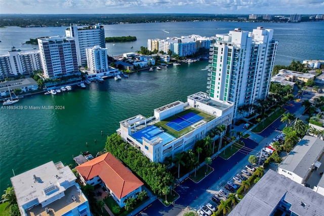 birds eye view of property with a water view