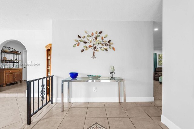 doorway featuring ceiling fan, french doors, and light tile patterned flooring