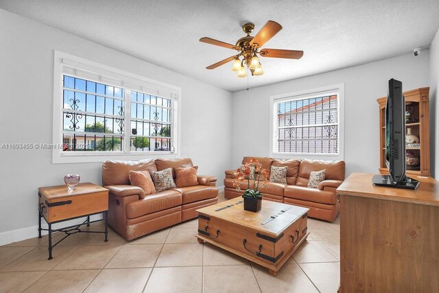 living room featuring a wealth of natural light and light tile patterned flooring