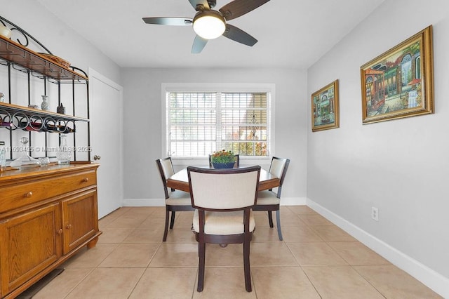 dining room featuring ceiling fan and light tile patterned floors