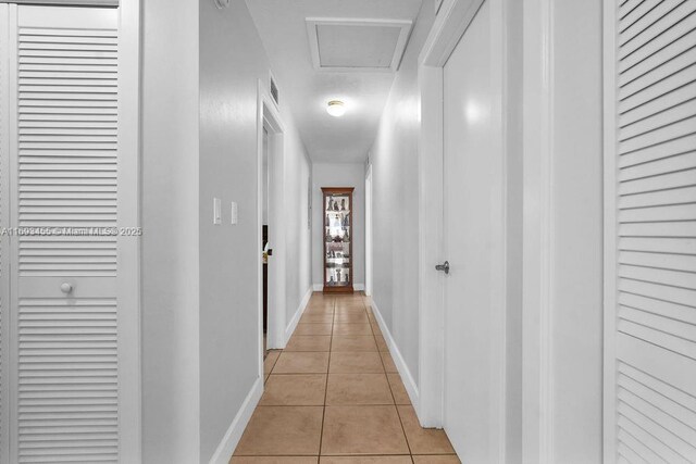 bedroom with ceiling fan and light tile patterned floors