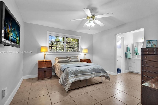 tiled bedroom featuring ceiling fan and connected bathroom