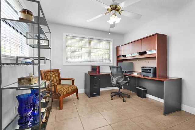 tiled home office with ceiling fan