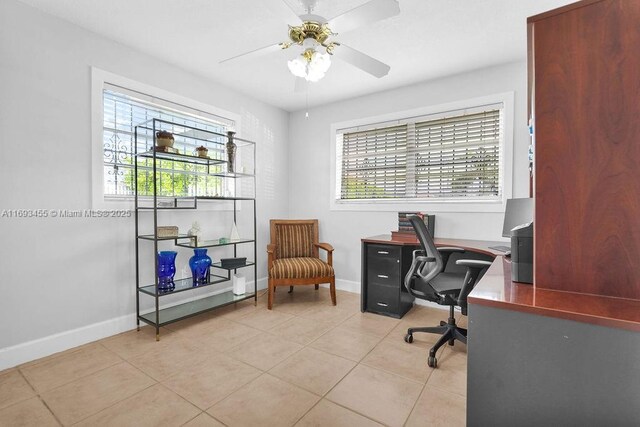 office area with ceiling fan and light tile patterned flooring