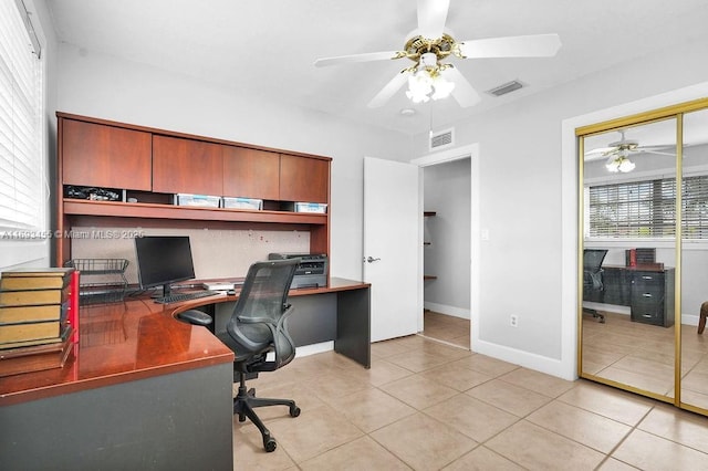 office with ceiling fan and light tile patterned flooring