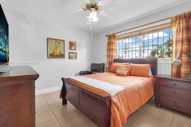 bedroom featuring ceiling fan and light tile patterned flooring