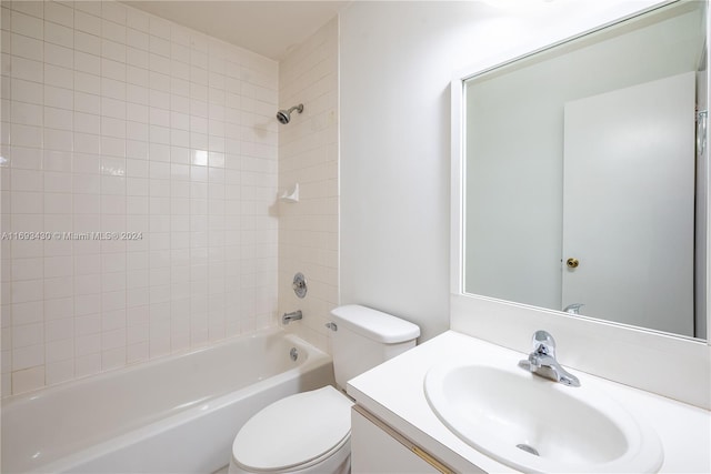 full bathroom featuring vanity, toilet, and tiled shower / bath