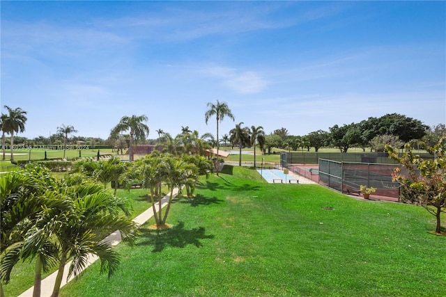 view of yard featuring a rural view and tennis court