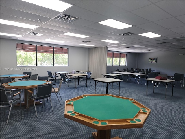 game room featuring carpet and a drop ceiling